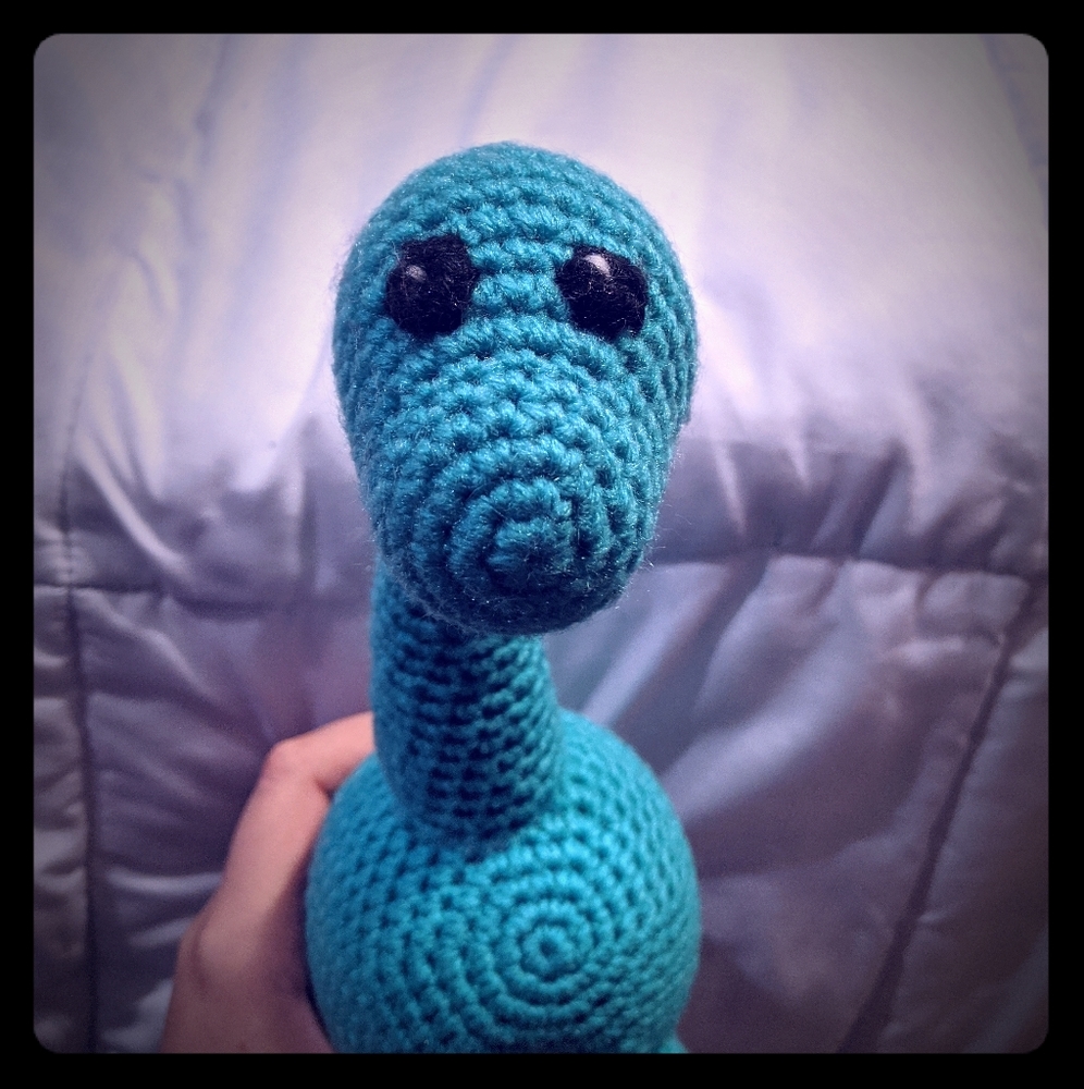 Handmade crochet green dinosaur